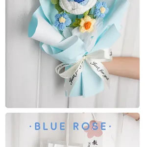 Close-up of a handmade knitted blue rose bouquet with a white Just For You ribbon.