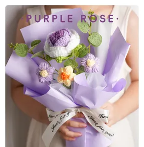 Handmade crochet purple rose bouquet wrapped in lilac paper with ribbon close-up