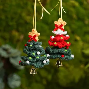 Handmade crocheted Christmas tree ornaments set with bells and red bows for holiday home decor