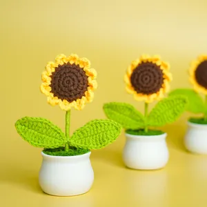 Hand-crocheted sunflower potted plant in a white pot, perfect for home decor and gifts.