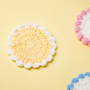 Handmade crochet yarn coaster in macaron colors with scalloped edge for home decor