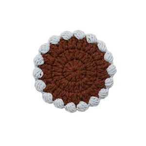 Handmade crochet round hot pad coaster with brown center and light blue scallop border