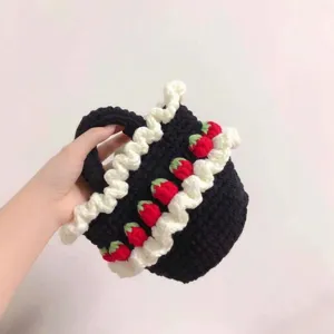 Handmade crochet strawberry ruffle handbag in black and white with cute designs