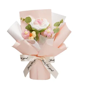 Handmade crochet rose flower bouquet in elegant pink wrapping paper with printed ribbon