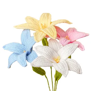 Handmade crochet lily bouquet featuring white, pink, blue, and yellow yarn flowers.