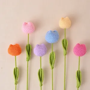 Handmade crocheted tulips in various colors for home decoration and gifts.