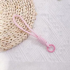 Detailed view of pink braided anti-lost wrist strap with plastic clip ring