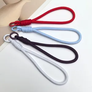 Detail view of handmade woven phone wrist lanyards in four vibrant Dopamine colors