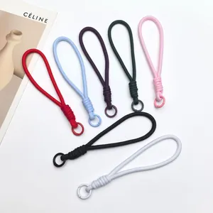 Detailed macro view of multi-colored handmade braided hand straps in vibrant dopamine colors