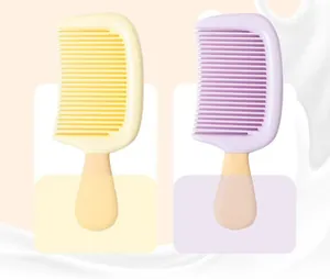 Detail of pastel yellow and purple popsicle-shaped combs for kids, ice cream design.