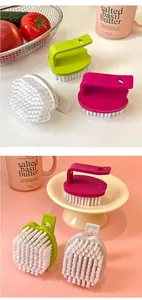 Macro view of candy-colored egg-shaped laundry and shoe cleaning brushes in lifestyle setting