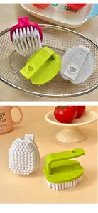 Macro detail of egg-shaped laundry brushes with heart-shaped ergonomic handles.