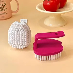 Set of fashionable egg-shaped laundry and shoe cleaning brushes in candy colors