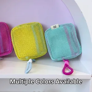 Close-up of colorful square mesh cosmetic pouches on white shelf display