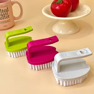 Set of three colorful egg-shaped cleaning brushes for laundry, clothes, and shoes