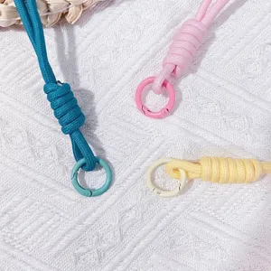 Colorful hand-woven mobile phone wrist straps in bright dopamine colors for anti-loss