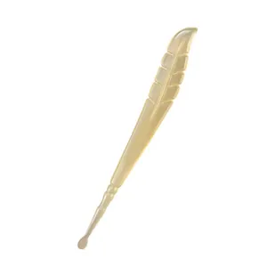 Cream feather-shaped ear pick tool for gentle ear canal cleaning and care.