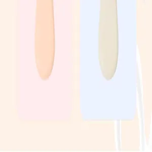 Close-up detail of pastel pink and blue ice cream style children's comb handles