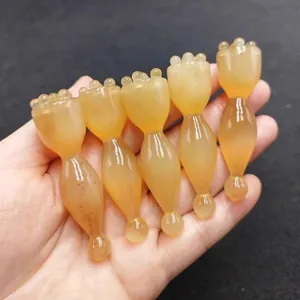 Amberkleurige lotus oogmassage gereedschap voor gezichtsschrapen en donkere kringen