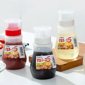 Close-up of three clear condiment squeeze bottles with sauce, oil, and vinegar contents