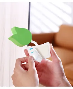 Close-up showing the 3M adhesive backing of a green leaf-shaped foam finger guard