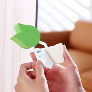 Green leaf shaped foam door stopper pinch guard for baby safety with adhesive tape