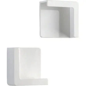 Makro-Detailansicht der weißen minimalistischen klebenden Handy-Ladestation für die Wand