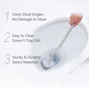 Grey long handle Japanese style toilet brush cleaning a white ceramic toilet bowl