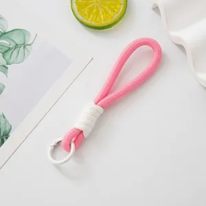 Handmade woven rope keychain charm in pink and white for accessories