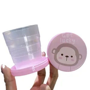 Vaso de agua plegable portátil para viajes con un lindo diseño de tapa de mono rosa de dibujos