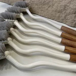 Japanese-style long-handle toilet cleaning brush with curved white body and wooden grip