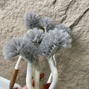 Detailed view of curved Japanese style toilet brushes featuring dense grey cleaning bristles