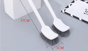 Close-up detail of white long-handle toilet brush set with 37cm and 5cm dimensions