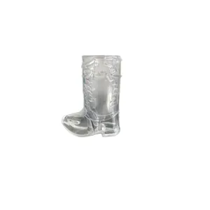 Clear plastic cowboy boot shaped shot glass for Western theme party beverage service