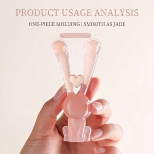 Masajeador facial manual con forma de conejo rosa para lifting y masaje de nariz