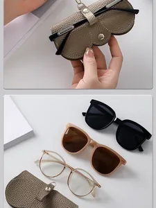 Vue détaillée de l'étui à lunettes en cuir kaki avec fermeture à pression sécurisée