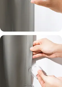 Detail showing transparent punch-free curtain clips fixing a grey fabric shower curtain