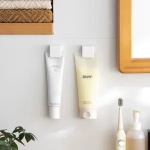 Wall Mounted Punch Free Toothpaste Holder Facial Cleanser Storage Rack Bathroom Adhesive Toothpaste Squeezer Clip Organizer
