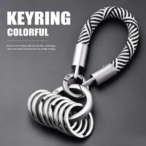 Detail macro view of the woven black and white rope keychain with multiple durable metal rings