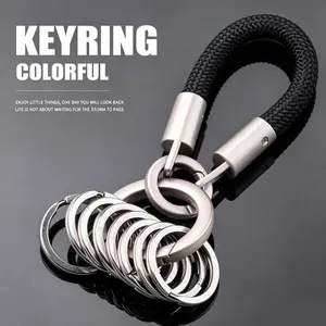 Detailed view of black braided rope car keychain with multiple metal rings