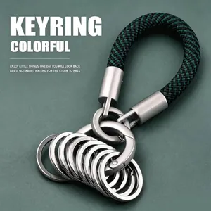 Close-up detail of a dark green woven rope keyring featuring a multi-ring design