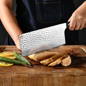 Forged hammered kitchen chef knife with sharp blade, durable wooden cutting board friendly.