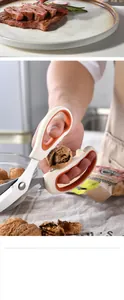 Macro detail of multi-functional stainless steel kitchen scissors cracking a tough walnut