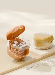 Detail view of portable orthodontic retainer storage box with cleaning tools and tablets