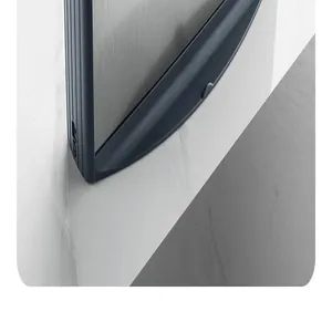 Macro detail of the modern brushed metal panel and curved edge on a kitchen knife holder