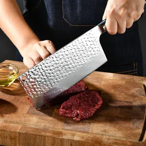 Hand-forged hammered texture Chinese cleaver with ergonomic solid wood handle for slicing meat.