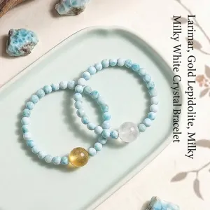 Elegant natural Larimar and Lepidolite beaded bracelet set on a soft green ceramic tray.