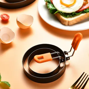 Stainless steel fried egg ring mold with orange heat-resistant silicone handle