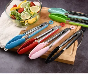 Multi-color 9-inch stainless steel food tongs with silicone heads on a wooden board