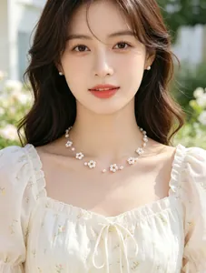 Elegant detail of a dainty pearl flower beaded necklace worn by a model in soft light
